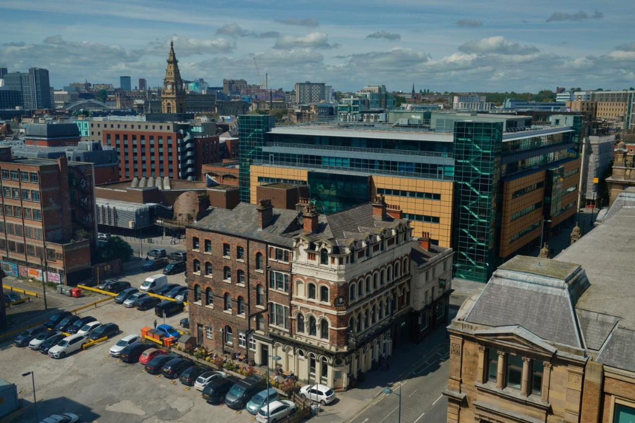 an aerial view of a city with buildings and cars at Sidemersey Livings - 2 Bedroom Central Skyline Apartment with views and parking in Liverpool